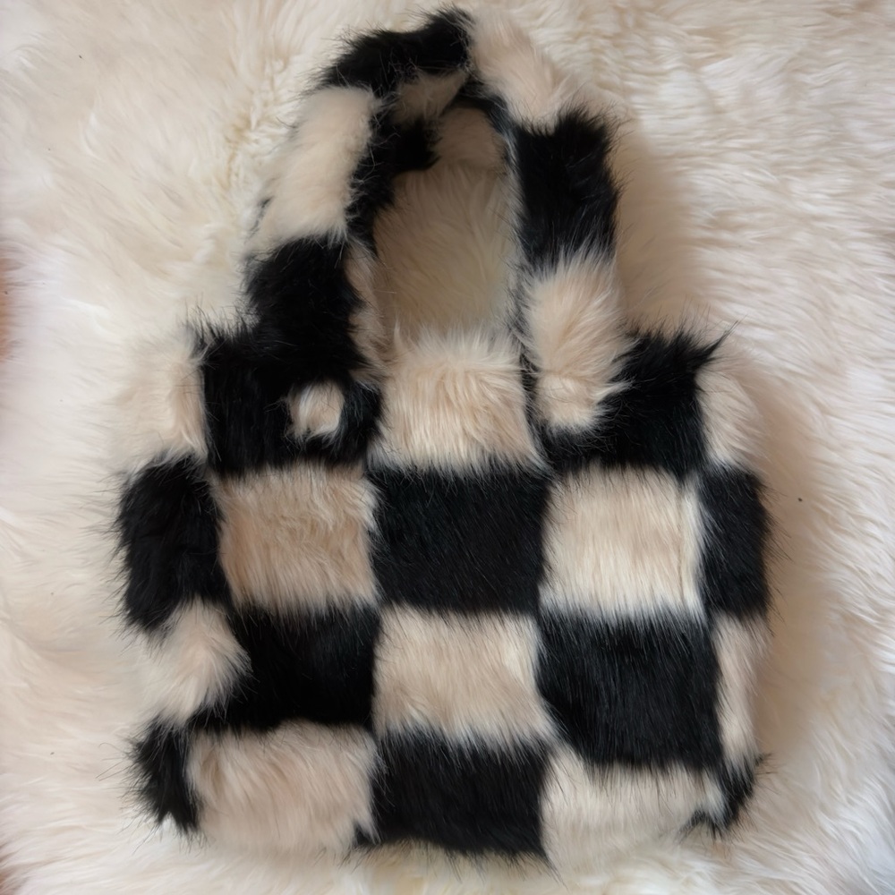 Stand studio faux fur checkered patterned top handle purse